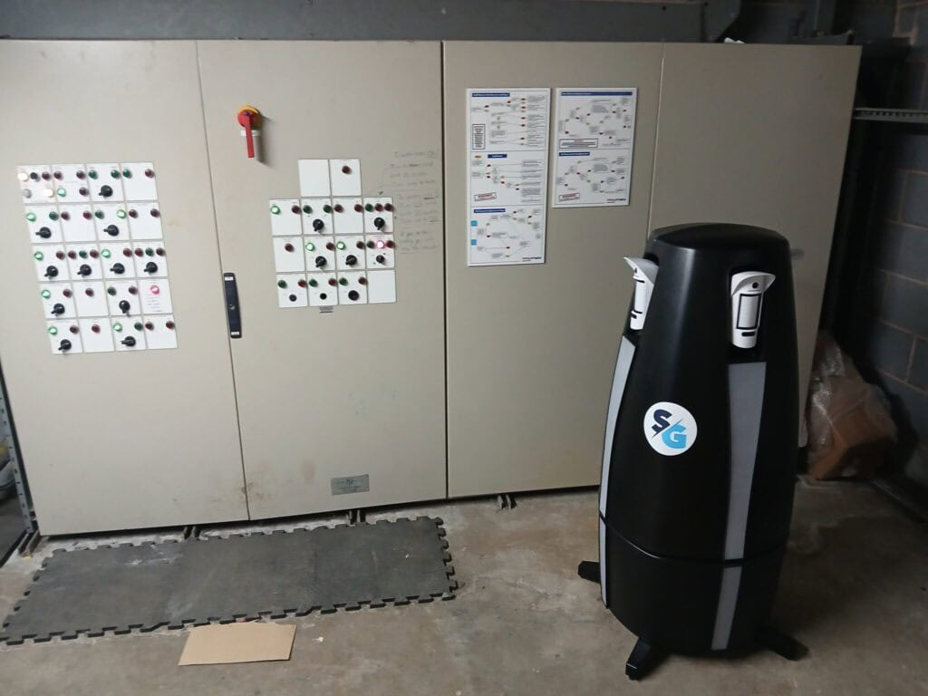 Alt text: Industrial control panel with switches and diagrams for electrical system management.