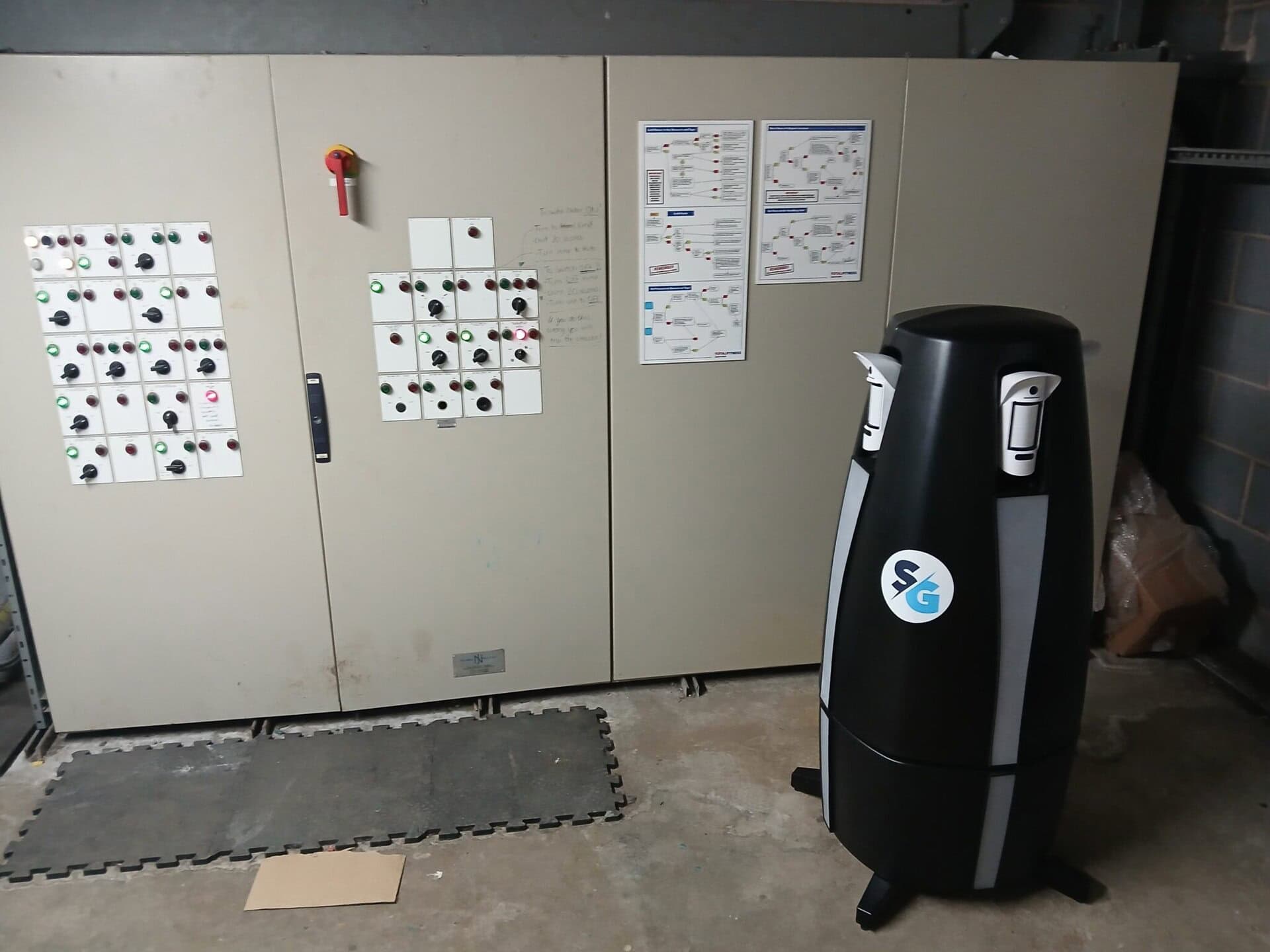Alt text: Industrial control panel with switches and diagrams for electrical system management.