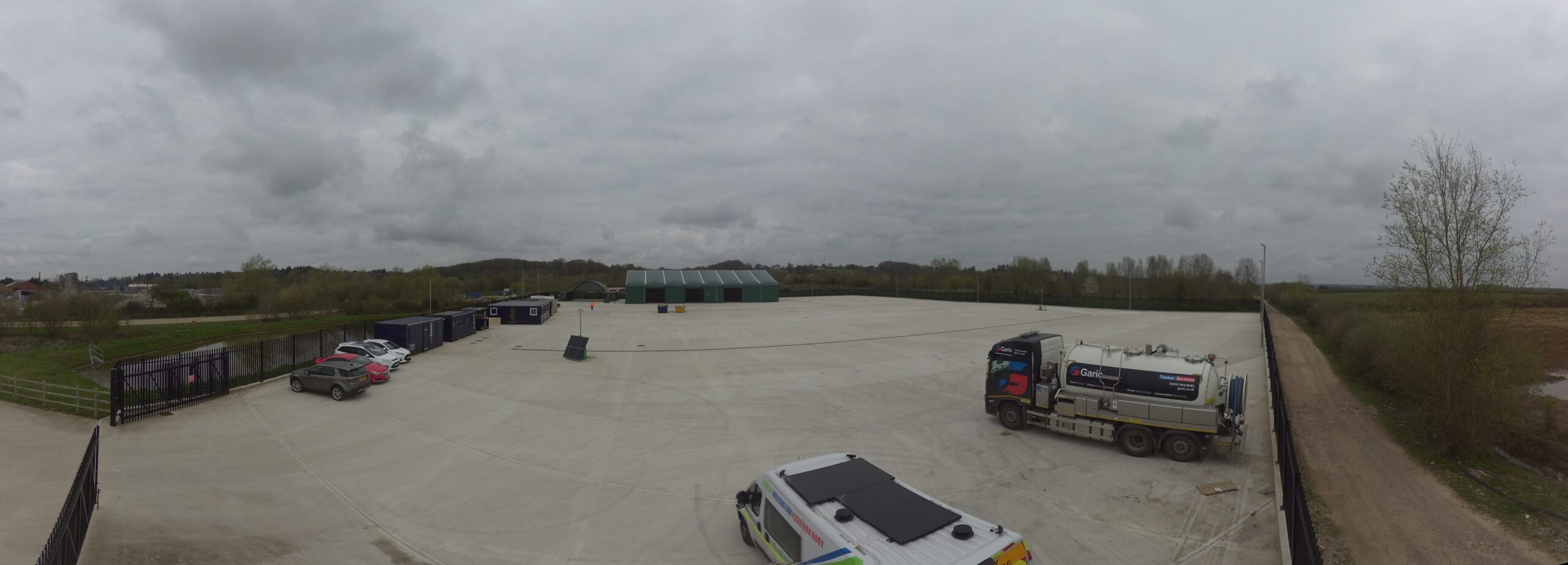 Exterior view of Garic Reading Depot with parking area and storage units.